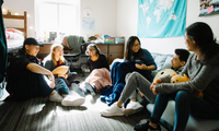 students sitting in a dorm room